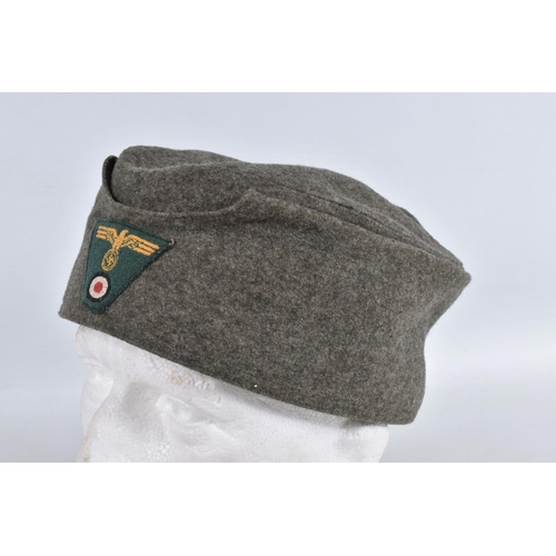 364 - TWO WWII ERA STYLE GARMAN ARMY HATS, the first is a field cap with Luftwaffe insignia to the front a... 