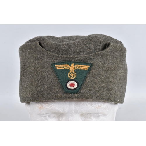 364 - TWO WWII ERA STYLE GARMAN ARMY HATS, the first is a field cap with Luftwaffe insignia to the front a... 