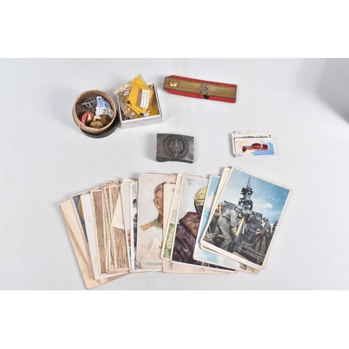 366 - A COLLECTION OF POSTCARDS AND OTHER ITEMS, to include a German Belt Buckle for The Hitler Youth, bad... 