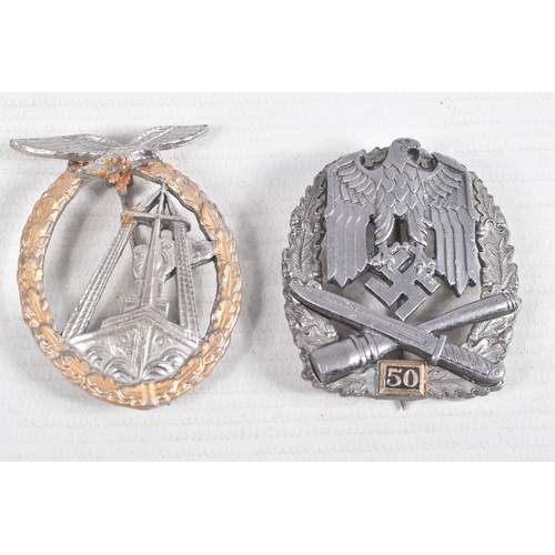 374 - A GERMAN LUFTWAFFE SEA BATTLEBADGE AND A THIRD REICH GENERAL 50 MISSIONS BADGE, the first has a roun... 