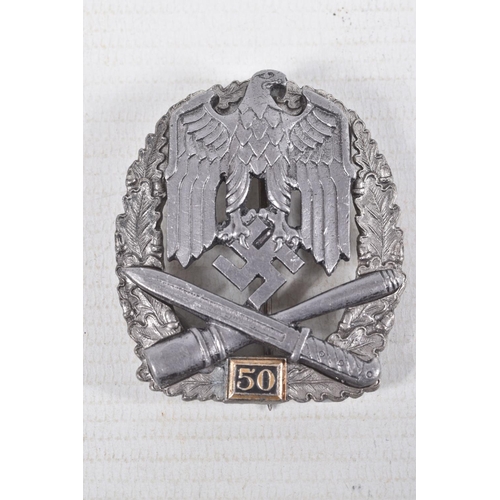 374 - A GERMAN LUFTWAFFE SEA BATTLEBADGE AND A THIRD REICH GENERAL 50 MISSIONS BADGE, the first has a roun... 