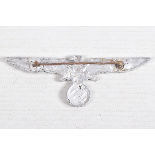 375 - THREE GERMAN BADGES, to include a short range bomber clasp, a metal clasp eagle and Germany-Japan al... 