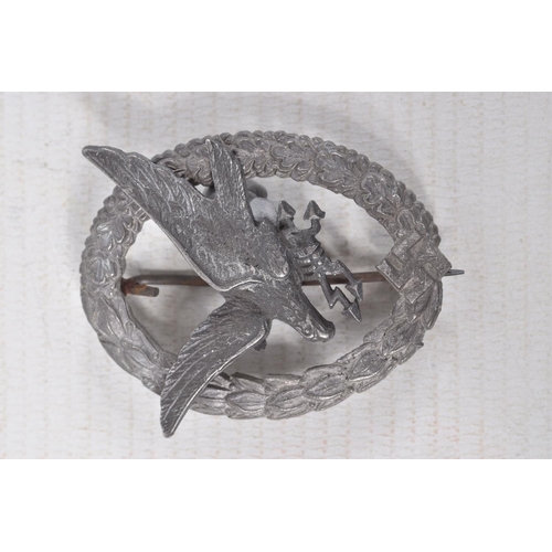 376 - THREE GERMAN BADGES, to include a luftwaffe radio operator and gunners badge, a Flak Gunners badge a... 