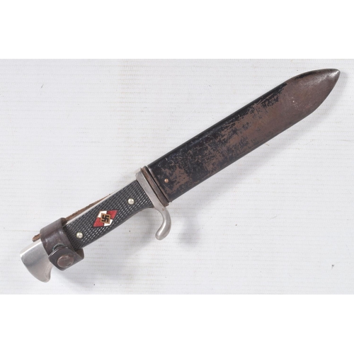 387 - A GERMAN HJ KNIFE IN ITS ORIGINAL SCABBARD, the motto Blut Und Ehre is on one side and the other sid... 