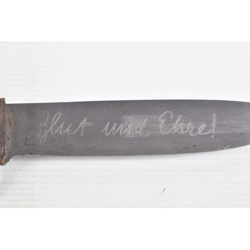 387 - A GERMAN HJ KNIFE IN ITS ORIGINAL SCABBARD, the motto Blut Und Ehre is on one side and the other sid... 