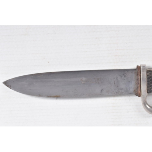 387 - A GERMAN HJ KNIFE IN ITS ORIGINAL SCABBARD, the motto Blut Und Ehre is on one side and the other sid... 