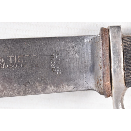 387 - A GERMAN HJ KNIFE IN ITS ORIGINAL SCABBARD, the motto Blut Und Ehre is on one side and the other sid... 