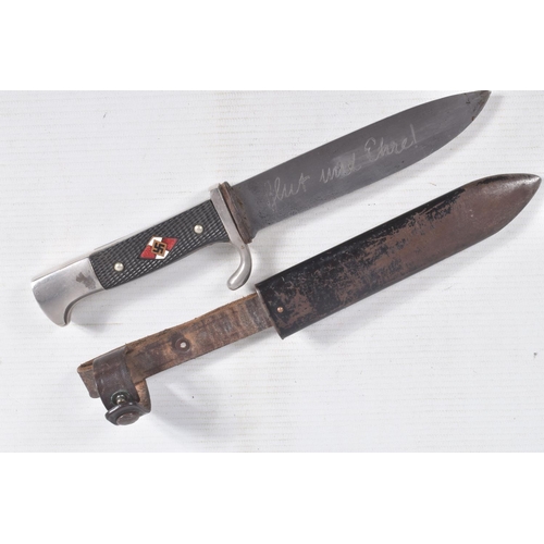 387 - A GERMAN HJ KNIFE IN ITS ORIGINAL SCABBARD, the motto Blut Und Ehre is on one side and the other sid... 