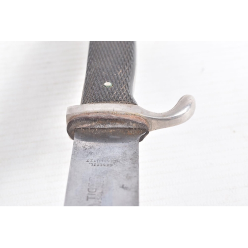 387 - A GERMAN HJ KNIFE IN ITS ORIGINAL SCABBARD, the motto Blut Und Ehre is on one side and the other sid... 