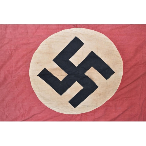 390 - A LARGE WWII ERA GERMAN FLAG, this has faded and was bought back from WWII by the vendors family mem... 