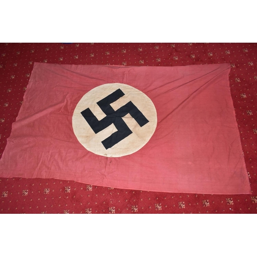 390 - A LARGE WWII ERA GERMAN FLAG, this has faded and was bought back from WWII by the vendors family mem... 