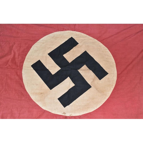 390 - A LARGE WWII ERA GERMAN FLAG, this has faded and was bought back from WWII by the vendors family mem... 