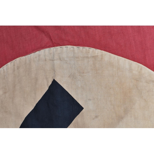 390 - A LARGE WWII ERA GERMAN FLAG, this has faded and was bought back from WWII by the vendors family mem... 