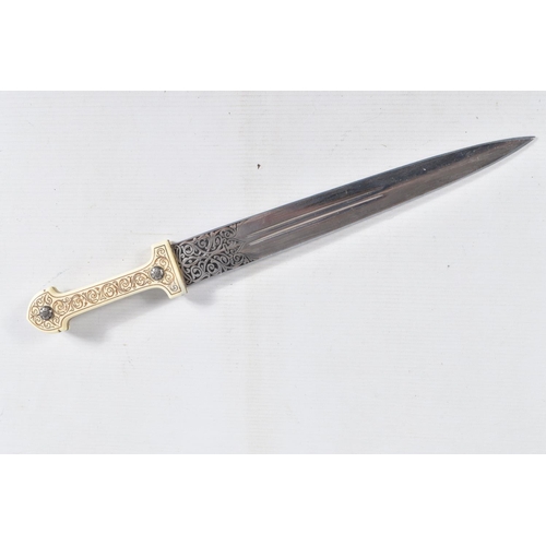 397 - A DECORATIVE DAGGER WITH A CARVED HANDLE WITH EMBOSSED BLADE, this comes in a metal banded leather s... 