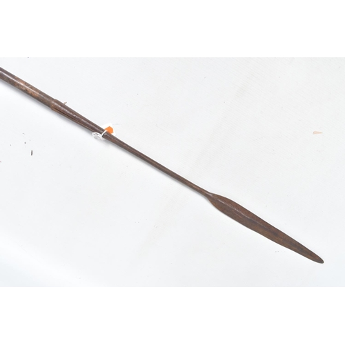 410 - THREE TRIBAL HUNTING SPEARS, the first features a wooden shaft and a grooved arrow shaped steel tip,... 