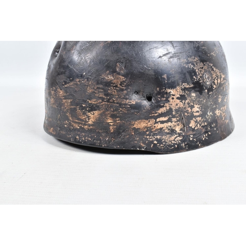 412 - A WWII RELIC OF A GERMAN HELMET, this appears to be a Fallschirmjager or Paratroopers helmet, the ve... 