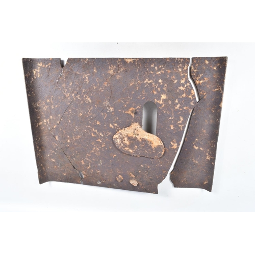 413 - A WWI RELIC OF A METAL SNIPERS PROTECTIVE PLATE, split in two with numerous cracks throughout, aged ... 