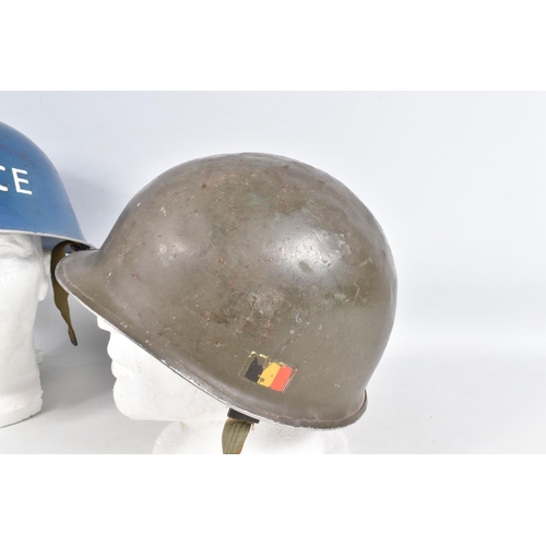 415 - A WWII ERA POLICE STEEL HELMET AND THREE OTHERS, the blue police helmet has a liner and chinestrap s... 