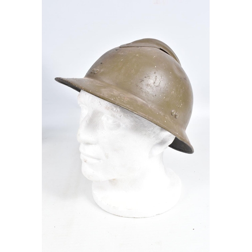 415 - A WWII ERA POLICE STEEL HELMET AND THREE OTHERS, the blue police helmet has a liner and chinestrap s... 