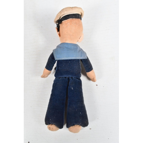 416 - A VINTAGE NORA WELLINGS SAILOR DOLL, a leather belt with a collection of cap and collar badges on it... 