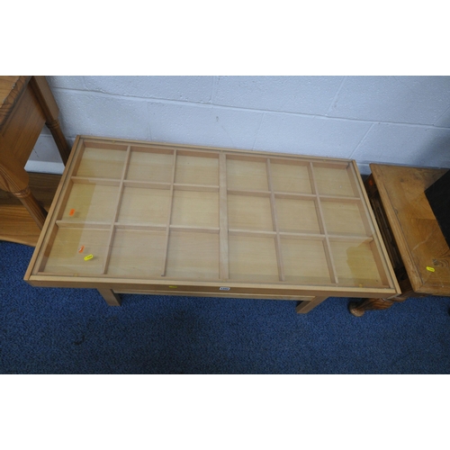 1202 - A MODERN BEECH GLASS TOP COFFEE TABLE, with a single drawer to each end and a selection of dividers,... 