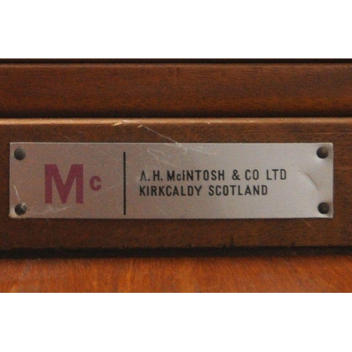 1203 - A.H MCINTOSH AND CO LTD, KIRKCALDY, SCOTLAND, A MID CENTURY TEAK TRIFORM NEST OF THREE TABLES, with ... 