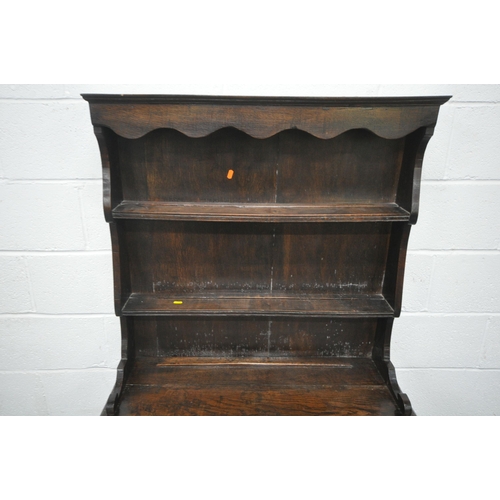 1208 - A REPRODUCTION GEORGIAN STYLE OAK DRESSER, of small proportions, the two tier plate rack, atop a bas... 