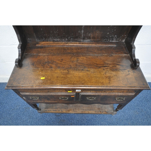 1208 - A REPRODUCTION GEORGIAN STYLE OAK DRESSER, of small proportions, the two tier plate rack, atop a bas... 