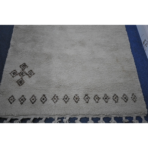 1214 - A LATE 20TH CENTURY MOROCCAN CREAM RECTANGULAR SHAG PILE RUG, with geometric design, 228cm x 153cm (... 