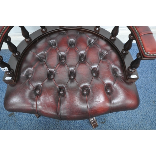 1219 - AN OXBLOOD BUTTONED LEATHER SWIVEL OFFICE CHAIR, width 61cm x depth 65cm x height 79cm (condition re... 