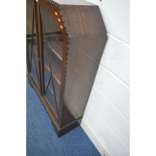 1223 - AN EARLY 20TH CENTURY OAK BOOKCASE, with double lead glazed doors, width 92cm x depth 27cm x height ... 