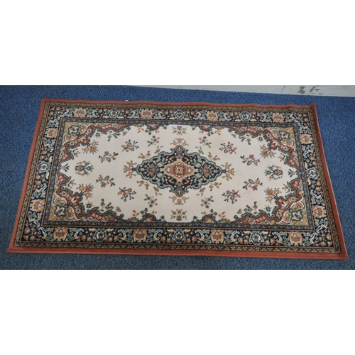 1224 - A SMALL RECTANGULAR LAURA RUG, with beige field, central medallion, surrounded by a multi-strap bord... 