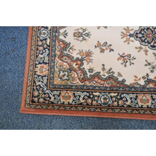 1224 - A SMALL RECTANGULAR LAURA RUG, with beige field, central medallion, surrounded by a multi-strap bord... 