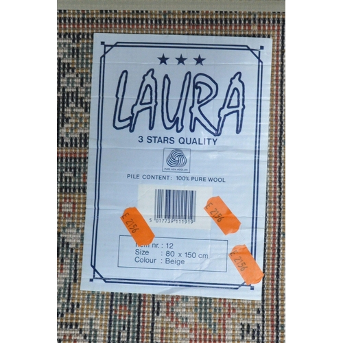 1224 - A SMALL RECTANGULAR LAURA RUG, with beige field, central medallion, surrounded by a multi-strap bord... 