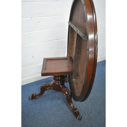 1233 - A 19TH CENTURY MAHOGANY TILT TOP BREAKFAST TABLE, raised on a bulbous turned support and three cabri... 