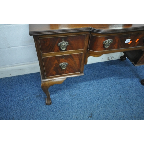 1236 - A REPRODUCTION MAHOGANY DRESSING TABLE, with a single bevelled edge mirror, an arrangement of five d... 