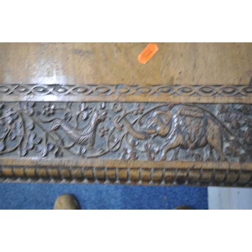 1238 - AN ANGLO INDIAN HARDWOOD CARVED OCCASIONAL TABLE, with foliate and animal carvings, shaped apron, ra... 