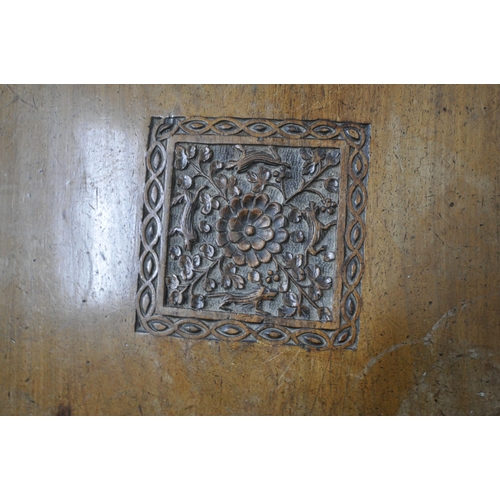 1238 - AN ANGLO INDIAN HARDWOOD CARVED OCCASIONAL TABLE, with foliate and animal carvings, shaped apron, ra... 