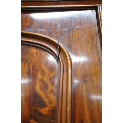 1241 - A 19TH CENTURY FLAME MAHOGANY LINEN PRESS, fitted with double doors, atop a base with two short over... 