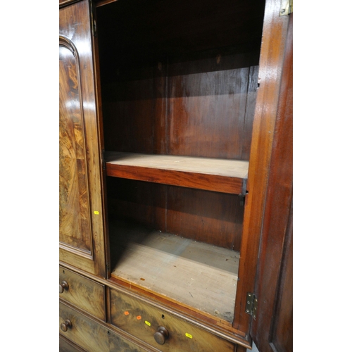 1241 - A 19TH CENTURY FLAME MAHOGANY LINEN PRESS, fitted with double doors, atop a base with two short over... 