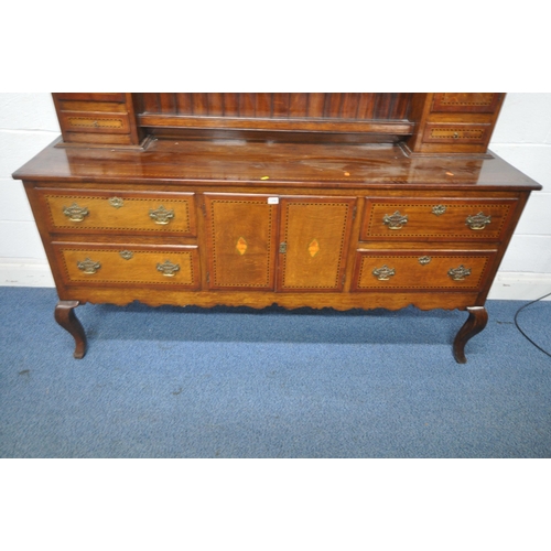 1242 - A GEORGIAN STYLE REPRODUCTION OAK DRESSER, the top fitted with two doors, two drawers, an arrangemen... 