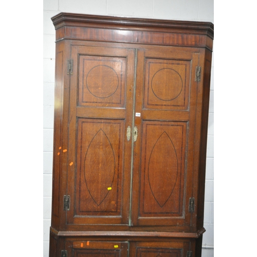 1244 - A LARGE GEORGIAN OAK CORNER CUPBOARD, fitted with four doors, enclosing shelves, width 114cm x depth... 