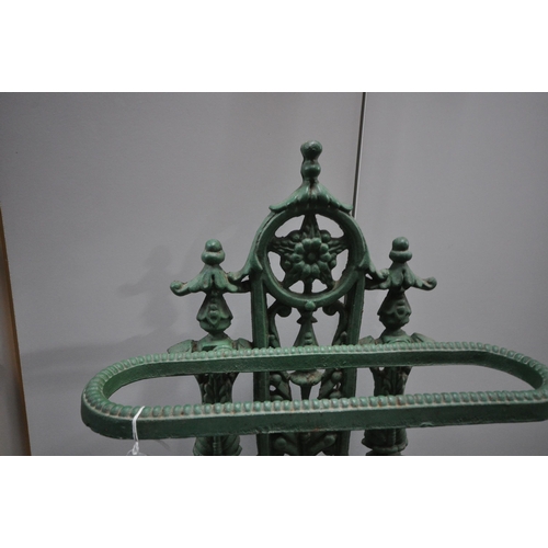 1246 - A GREEN PAINTED CAST IRON UMBRELLA / STICK STAND, with a white painted drip tray, width 48cm x depth... 