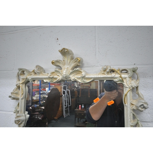 1247 - A CREAM RESIN CONSOLE TABLE, with glass insert, floral apron, the top surface been held aloft by a c... 