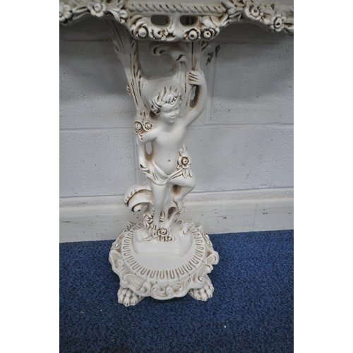 1247 - A CREAM RESIN CONSOLE TABLE, with glass insert, floral apron, the top surface been held aloft by a c... 