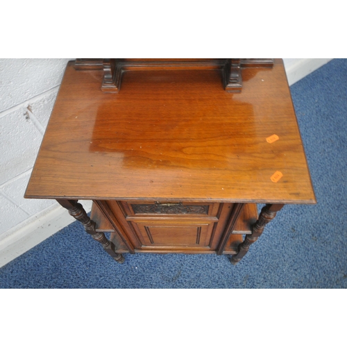 1251 - AN EDWARDIAN MAHOGANY PURDONIUM, the raised back with two shelves, atop a base with a fall front sto... 