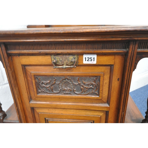 1251 - AN EDWARDIAN MAHOGANY PURDONIUM, the raised back with two shelves, atop a base with a fall front sto... 