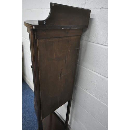 1258 - AN EDWARDIAN MAHOGANY BOW FRONT CORNER CUPBOARD, with a raised back, double lead lined stained glass... 