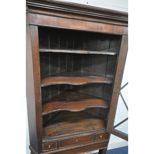 1263 - A GEORGIAN AND LATER OAK CORNER CUPBOARD, with a single astragal glazed door, above a single drawer ... 