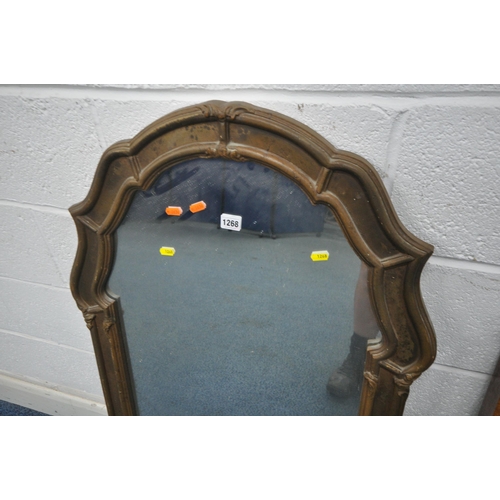 1268 - A GILT RESIN WALL MIRROR, with a shaped arched top, 66cm x 111cm, along with a wall mirror that has ... 